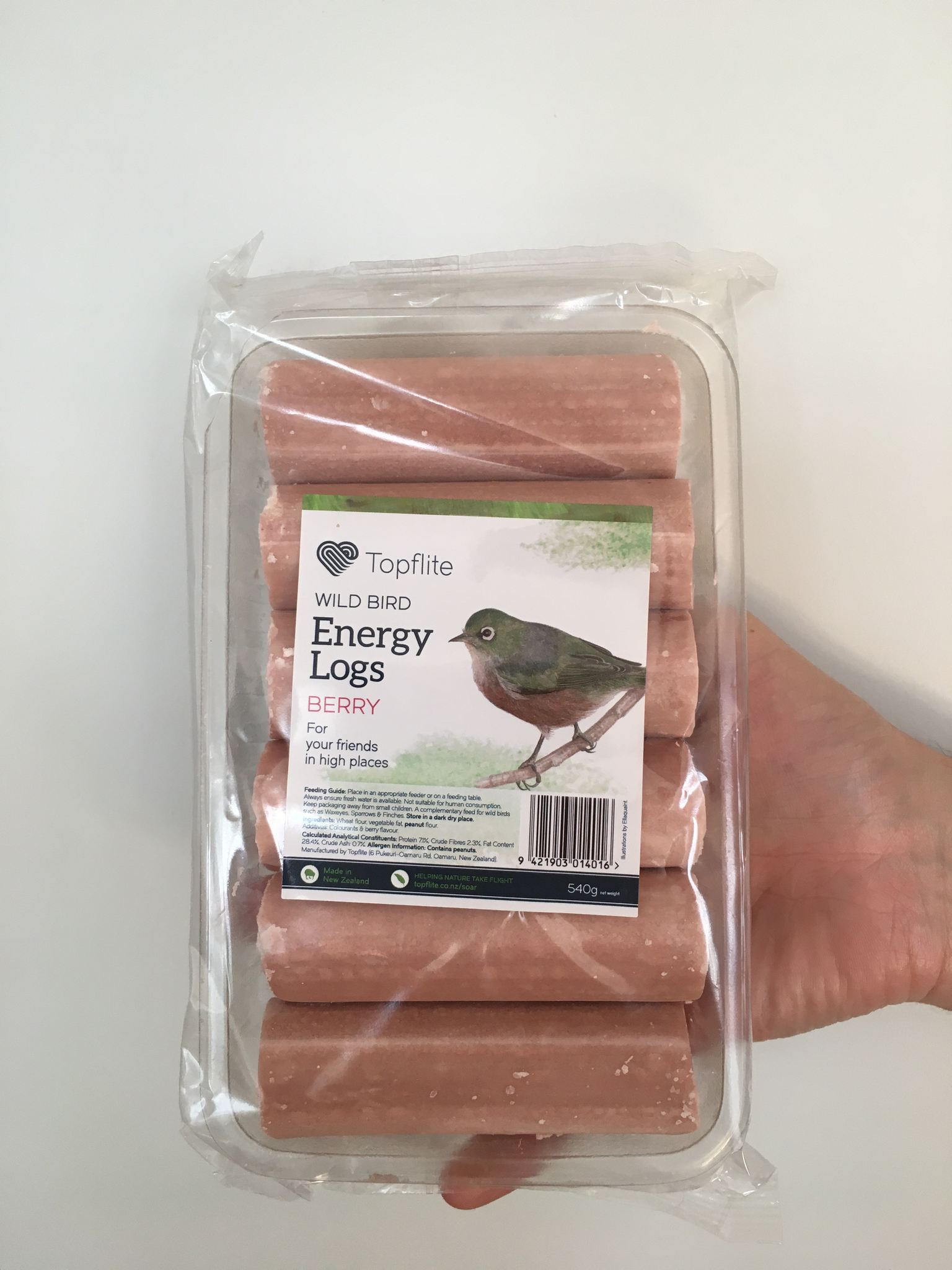 Energy logs for wild birds, berry flavour, pictured with a photo of tauhou, silvereye, wax-eye bird.