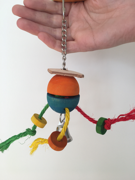 A hanging toy, with leather, a bell, some ropes, and a wooden ball that hangs closed. You could place a treat inside and get your parrot to work out how to open it.