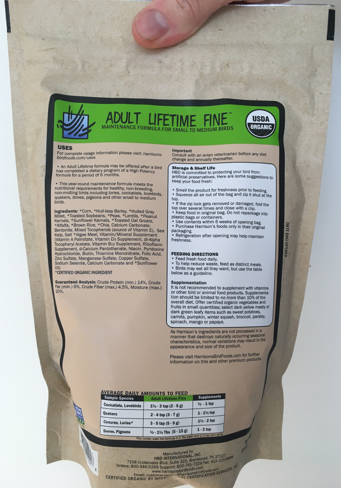 back of the green bag of Harrison's Adult Lifetime Fine premium pellets for parrots, shows feeding instructions, suitable for smaller birds