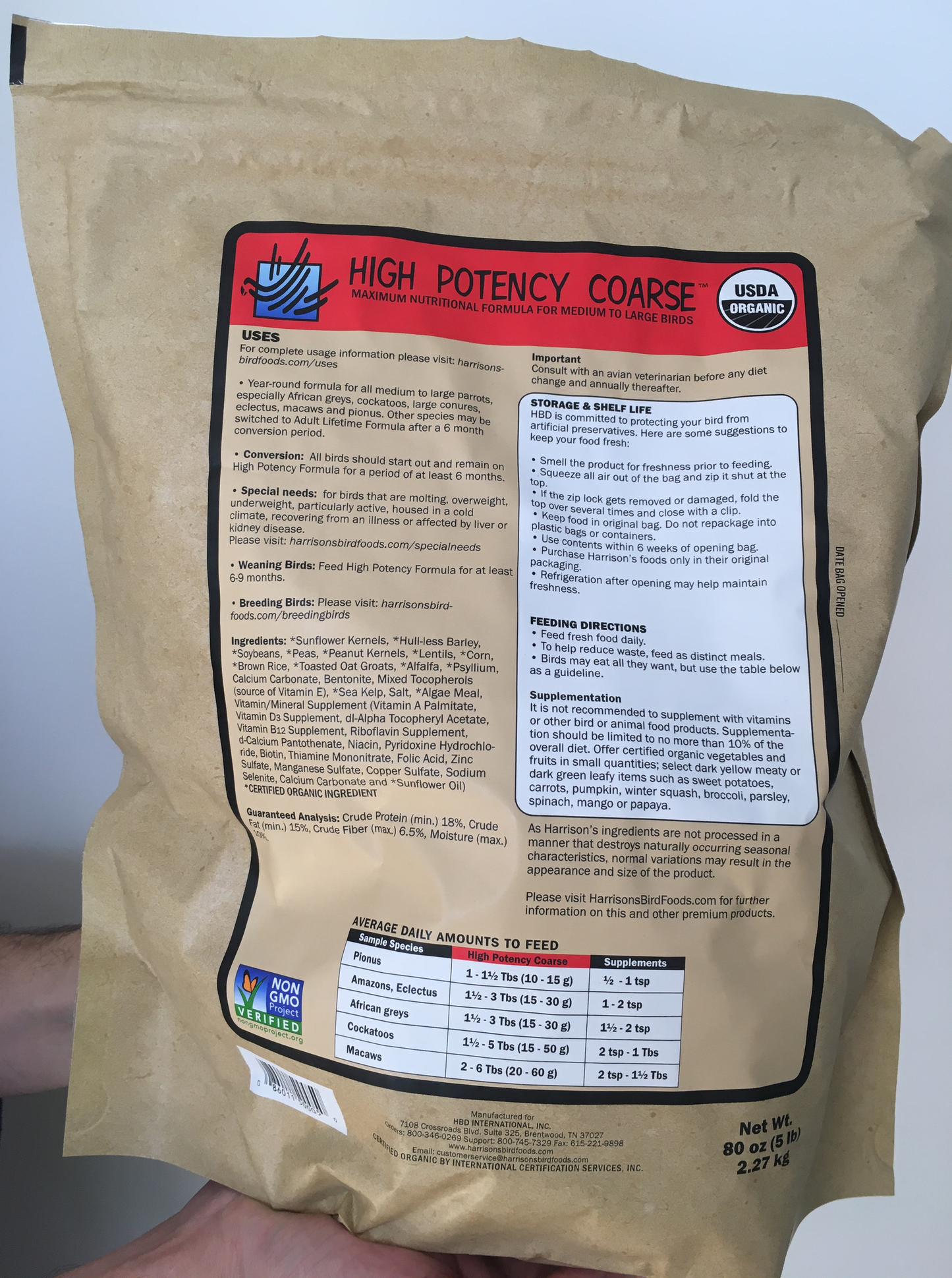 back of the large red bag of Harrison's High Potency Coarse premium pellets for parrots, suitable for larger birds with higher nutritional needs, with feeding instructions