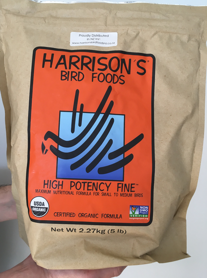 front of the large orange bag of Harrison's High Potency Fine premium pellets for parrots, suitable for smaller birds with higher nutritional needs