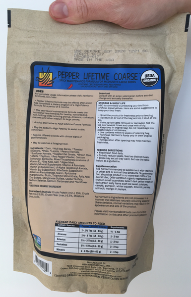 back of the small blue and orange bag of Harrison's Pepper Lifetime Coarse premium pellets for parrots, suitable for larger birds that like spicier food, with feeding instructions