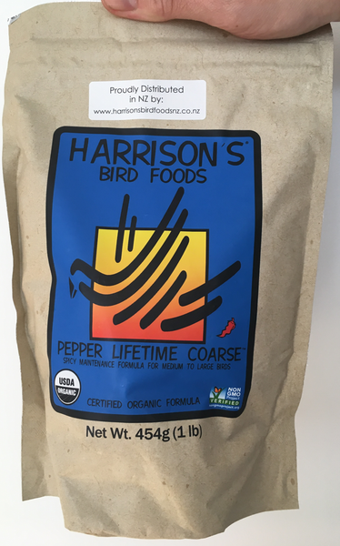 front of the small blue and orange bag of Harrison's Pepper Lifetime Coarse premium pellets for parrots, suitable for larger birds that like spicier food