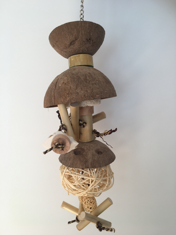 natural coconut chandelier bird toy for larger parrots, it has coconut halves, vine balls, wood, and calcium blocks